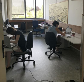 two people working at desks
